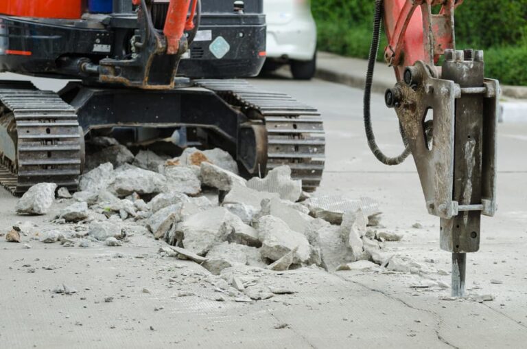 Road cement getting demolished — Demolishing & Remediation In Heatherbrae, NSW
